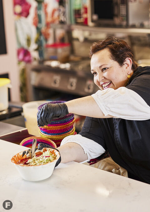 Red Kitchen KC owner serving